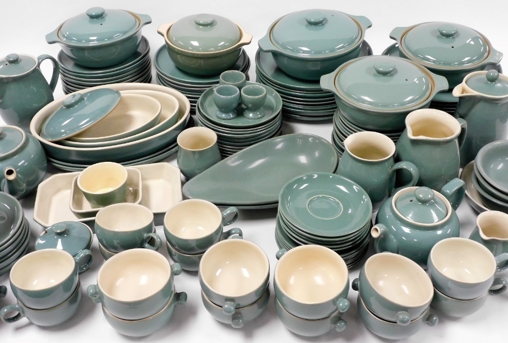 An extensive Denby Manor Green pottery tea and dinner service to include tureens dinner plates teapots two handled soup bowls milk jugs egg cups etc. a quantity