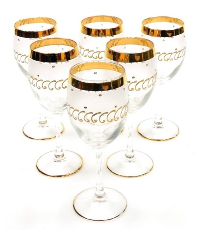 A set of six Murano wine goblets, with gold banding and raised gold scroll decoration to the main body, 19cm high, boxed.