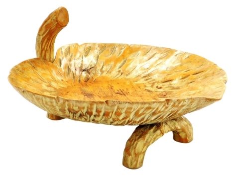 An Aldo Tura mid Century carved wooden leaf shaped fruit bowl, for Macabo, Cusano Milanino, Italy, with a branch shaped handle and foot, printed mark, 31cm wide.