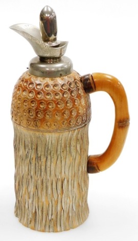 An Aldo Tura mid Century carved wooden thermos flask, for Macabo, Cusano Milanino, Italy, with metal mount and knopped cork stopper, printed mark, 29cm high.