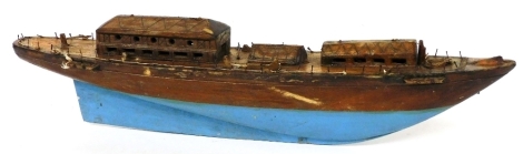 A teak mid 20thC wooden model of a Chinese junk, with realistic decking, partially painted blue, 77cm wide.