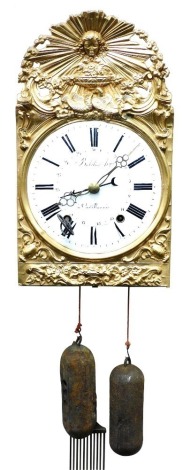 A French comtoise wall clock, by Bobilier, h'ger a Castillonnes, the circular enamel dial bearing Roman numerals, eight day movement, tin cased, the gilt metal fronted case embossed with the Sun King, doves, and flowers, with pendulum, two weights and key