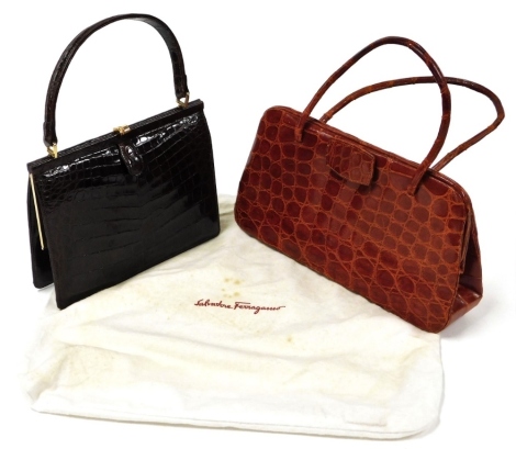 A Pisk vintage brown crocodile skin top handle bag, the brass coloured clasp enclosing a two sectional compartment with a separate coin purse, 27cm high including handle, and a burnt orange crocodile skin top handle bag, with a suede interior and separate