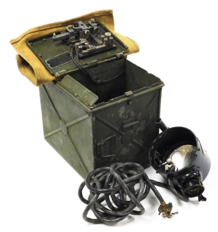 A World War II signal lamp, contained in a green metal case with canvas lid, the case 22cm high.