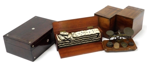 A group of treen, to include a 19thC rosewood and mother of pearl inlaid workbox, 25cm wide, two mahogany single tea caddies, 12cm high, a set of postage scales, and a quantity of bone dominoes contained in a treen case, the case 25cm wide.