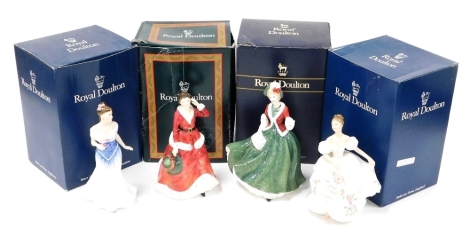 Four Royal Doulton porcelain figures, comprising For You HN3754, Winters Day HN3769, Lucy HN3653, and Christmas Day 2000 HN4242, all boxed.