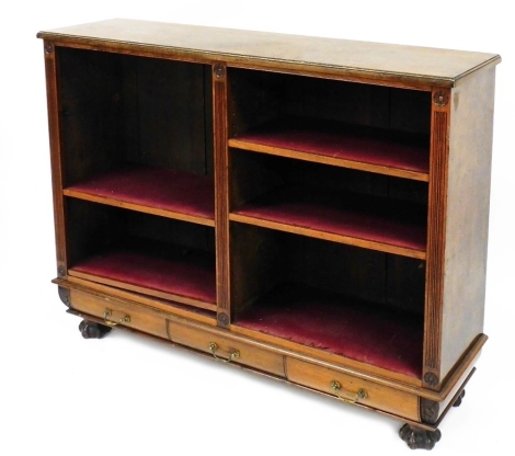 A late 19thC Continental walnut open bookcase, two division enclosing six shelves, above three frieze drawers, raised on ball and claw feet, 104.5cm high, 138cm wide, 36.5cm deep.