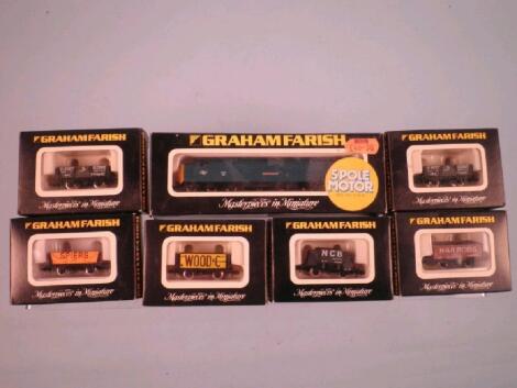 A Graham Farish N gauge locomotive and various items of rolling stock