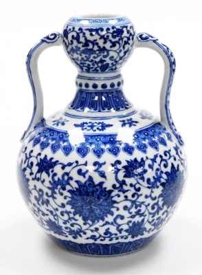 A fine Chinese blue and white porcelain vase, of bulbous shape with two handles, decorated with a band of formal scrolling peonies within bands of lappets, further scrolls and keyfret designs, the base with six character seal mark of Yongzheng period, but - 4