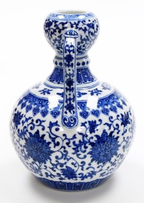 A fine Chinese blue and white porcelain vase, of bulbous shape with two handles, decorated with a band of formal scrolling peonies within bands of lappets, further scrolls and keyfret designs, the base with six character seal mark of Yongzheng period, but - 5