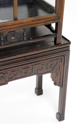 A Chinese hardwood glazed display cabinet, with various shelves raised on a platform stand with blind fret details, on square moulded legs, 93cm wide, 165cm high. - 5