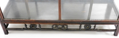 A Chinese hardwood glazed display cabinet, with various shelves raised on a platform stand with blind fret details, on square moulded legs, 93cm wide, 165cm high. - 6