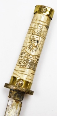 An early 20thC Japanese bone mounted tanto, carved to the handle and sheath in low relief with figures, with brass mounts and caps, steel blade, 44.5cm total length. - 3