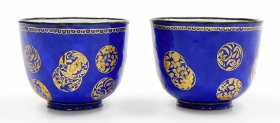 A pair of 19thC Chinese Canton enamel wine cups, decorated with overlapping gilt roundels on a blue ground, 6cm high. - 3