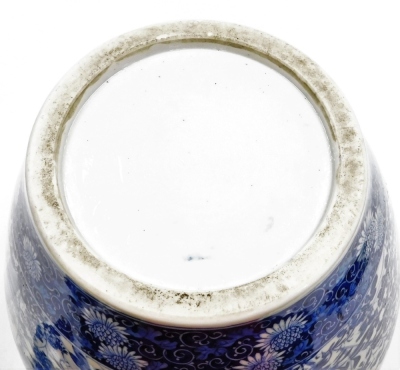 A Japanese Meiji period Seto blue and white porcelain vase and cover, of ovoid form, profusely decorated trees, flowers and blossom, within geometric and scroll banding, 56cm high. (AF) - 6