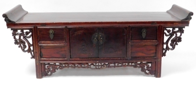 A Chinese stained wood writing table, carved with scrolling prunus blossom fret work, having a pair of central doors, flanked by two small drawers, 34cm high, 92cm wide, 17.5cm deep. - 2