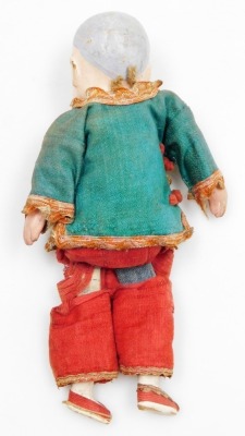 A late 19thC Chinese papier mache and wooden doll, with embroidered red trousers and green tunic, 19.5cm high. - 5