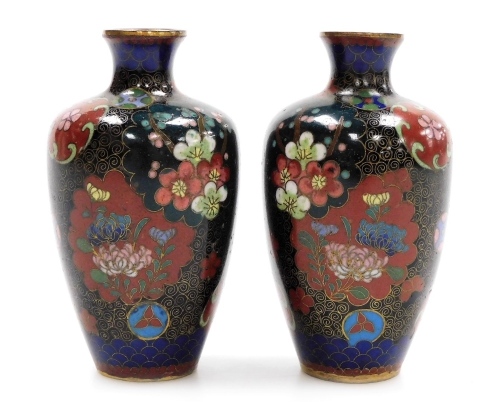 A pair of Japanese Meiji period cloisonne vases, decorated with panels of butterflies and flowers, 9cm high.