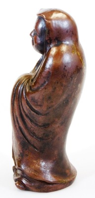 A Japanese Bizen figure of the Buddhist monk Daruma in standing pose, Meiji period, 25.8cm high. - 2