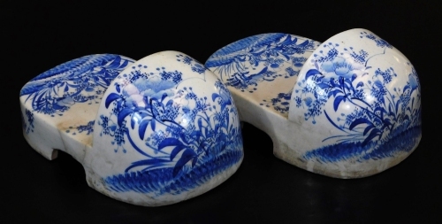 A very rare pair of Japanese Seto porcelain shoes, decorated in underglaze blue with poppies, Meiji period, 11.3cm high, 16.6cm wide, 27.8cm long.