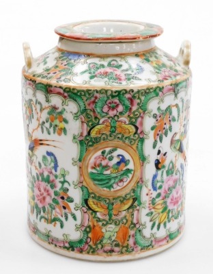 A 19thC Chinese Canton porcelain famille rose cannister and cover, decorated with reserves of birds, butterflies, and flowers, with two raised fittings for wire handles, 17cm high. (AF) - 3