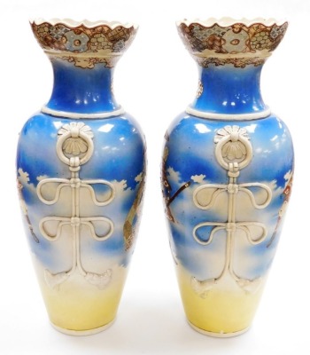 A pair of Japanese Meji period ovoid vases, with foliate rims and applied ring handles, with painted figures of Samurai on a sprayed blue and yellow ground, 54.4cm high. - 2