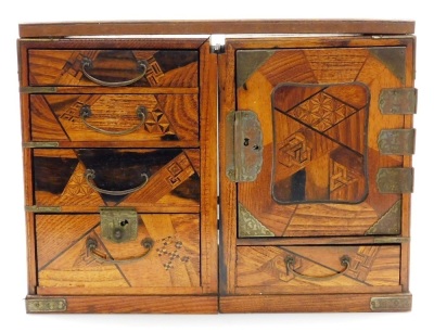 A Japanese Meiji period metamorphic parquetry travelling writing desk, comprising two cabinets with seven drawers and carrying handles, the removable top forming the writing surface when assembled, dimensions (when closed) 25cm high, 32.5cm wide, 22cm dee - 2