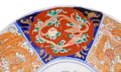 A Japanese Meiji period Imari plate, with panels of phoenix and dragons around a central roundel, 27.5cm diameter. - 4