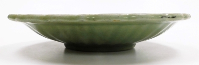 A Chinese celadon dish, with incised decoration within a wave border, probably 18thC, 32cm wide. - 3