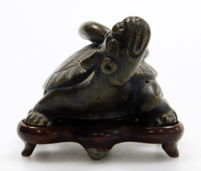 A Chinese bronze turtle, with snake on its back, on a carved hardwood base, the turtle 7cm wide. - 2