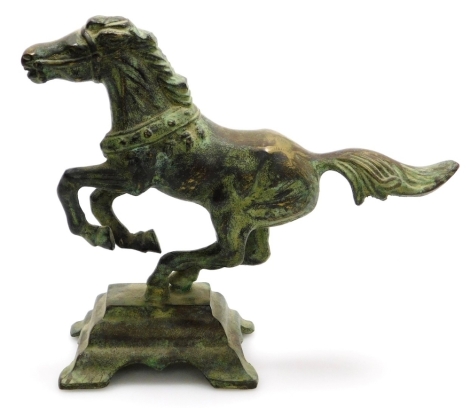 A Chinese bronze figure of a Tang style horse, rearing, on a stepped base, 15.5cm high, 19cm wide.