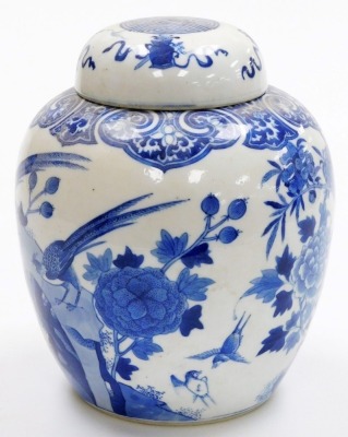 A 19thC Qing dynasty porcelain blue and white ginger jar and cover, painted with birds and flowers within a ryui border, the lid with Buddhistic emblems, bearing a four character Qianlong mark, 24cm high. - 4