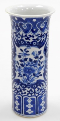 A Chinese blue and white cylindrical vase, with a flared rim, the body decorated with reserves of flowers and birds, 20cm high, and a modern Chinese oblong dish, decorated with houses and trees, within a floral decorated and hatched border, 29cm wide, 'ma - 6