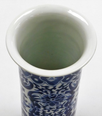 A Chinese blue and white cylindrical vase, with a flared rim, the body decorated with reserves of flowers and birds, 20cm high, and a modern Chinese oblong dish, decorated with houses and trees, within a floral decorated and hatched border, 29cm wide, 'ma - 8