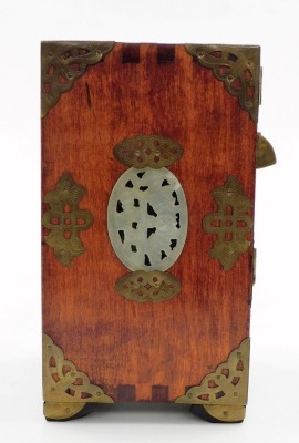 A Chinese hardwood jewellery casket, with brass handle and pierced mounts, carved simulated jade panels, the two hinged doors enclosing three drawers, above a further drawer to base, 22cm high, 15cm wide, 12cm deep, with lock and key. - 6