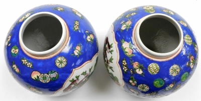 A pair of 20thC ginger jars and covers, decorated with birds on flowering branches against a blue ground, six character Qianlong mark in red to underside 27cm high. - 5