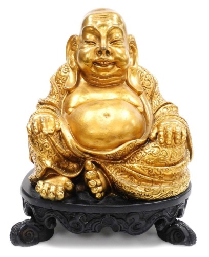 A gold coloured painted plaster figure of Putai, on stand, 34cm high.