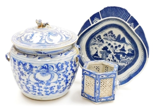 A Chinese blue and white porcelain jar and cover, with a dog of fo finial, 22cm high, a Willow pattern sweetmeat dish, 26cm wide, and a Japanese hexagonal brush pot with pierced sides, 9cm high.