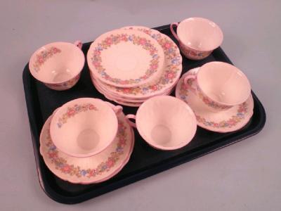 A Shelley part tea service printed with flowers and leaves within a pink band