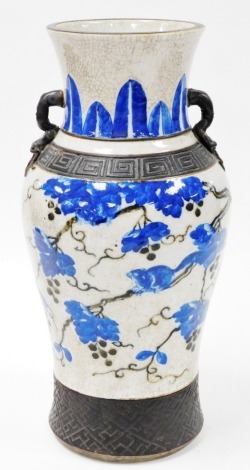 A 19thC Chinese crackle glazed baluster vase, with squirrels on vines, the upper part with blue lappets and chilin handles, banded with brown unglazed key and diaper decoration, four character seal mark to base, 43cm high