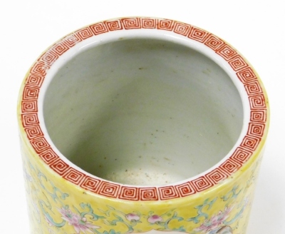 A 19thC Chinese porcelain famille jaune brush pot, with scrolling floral ground containing two shaped cartouches with enamel decoration of figures and landscape, 14cm high, 13cm diameter. - 5