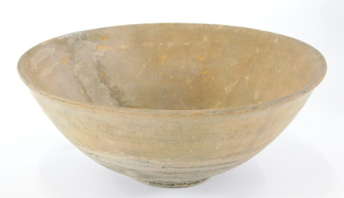 An archaic Chinese bowl, with everted rim and having glazed upper part and centre, 17cm diameter, boxed.