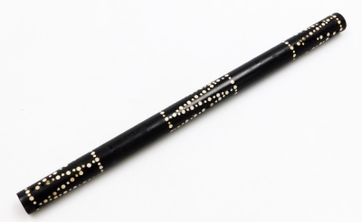 An ebony and ivory tribal baton, of cylindrical form, with three bands of dog tooth decoration, 36cm long.