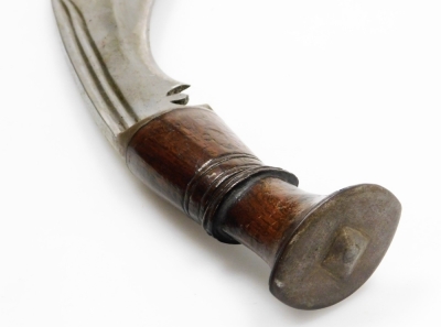 A Nepalese kukri, with edged and curved steel blade, having two narrow fullers to the back edge, with additional sharpening knife, in a leather sheath. - 3