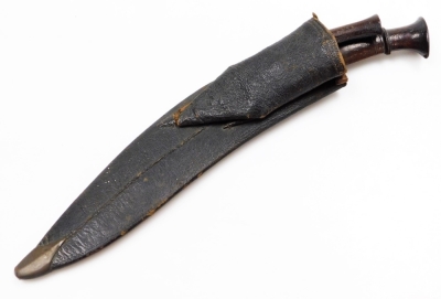 A Nepalese kukri, with edged and curved steel blade, having two narrow fullers to the back edge, with additional sharpening knife, in a leather sheath. - 5