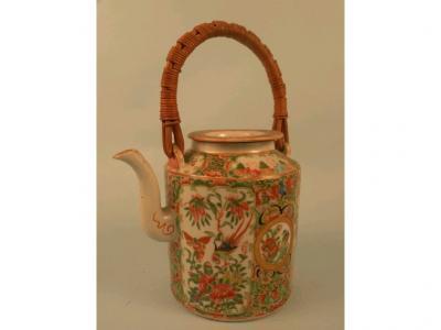 A late 19thC/early 20thC Chinese canton decorated cylindrical teapot and