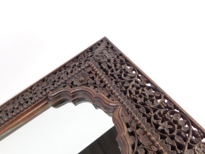 A Burmese carved wooden wall mirror, with pierced and fret carved border, with a rectangular arched top mirror plate, 51cm high, 34cm wide. - 3