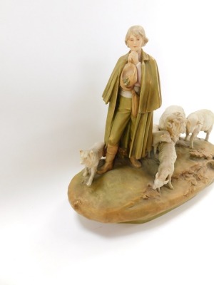 A Royal Dux figure group of sheep and a shepherdess with water vessel, the shepherdess modelled stood on a grassy bank, wearing a cloak, trousers, and boots, a hat clasped between his hands, a sheep dog stood to his right, and a ram, ewe and two lambs sto - 3