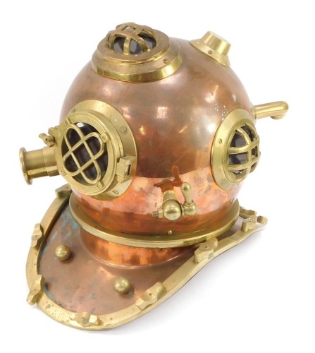 A Siebe Gorman reproduction copper and brass diver's helmet, 42cm high.