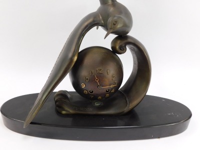 M Leducq. An Art Deco bronzed spelter mantel clock, with seagull over an orb on an oval black marble base, 64cm high, 45cm wide, 16cm deep. - 2